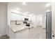 L-shaped kitchen with white cabinets, granite countertops, and stainless steel appliances at 5711 N 24Th Pl, Phoenix, AZ 85016