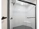 Large walk-in shower with marble tile, glass enclosure, and built-in bench at 5711 N 24Th Pl, Phoenix, AZ 85016