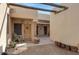 Charming entryway with desert landscape, wooden accents, and a decorative wooden door with star emblem at 5713 W Sun Dance Dr, Queen Creek, AZ 85144