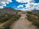 Aerial view of a sprawling desert property with a large house and private pool at 5713 W Sun Dance Dr, San Tan Valley, AZ 85144