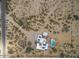 Aerial view of a home with pool and desert landscape at 5713 W Sun Dance Dr, San Tan Valley, AZ 85144