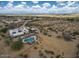 Aerial view showing the house, pool, and expansive desert lot at 5713 W Sun Dance Dr, San Tan Valley, AZ 85144