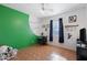 Bright bedroom with tiled floors, a window, and baseball-themed decor at 5713 W Sun Dance Dr, San Tan Valley, AZ 85144