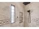 Modern shower with tiled walls and multiple niches at 5713 W Sun Dance Dr, San Tan Valley, AZ 85144