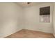 Simple bedroom with light walls and wood flooring at 5810 W Puget Ave, Glendale, AZ 85302