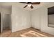 Bedroom with wood flooring, ceiling fan and double door closet at 5810 W Puget Ave, Glendale, AZ 85302