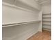 Large walk-in closet with double hanging rods and shelving at 5810 W Puget Ave, Glendale, AZ 85302