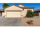 One-story house with a two-car garage and desert landscaping at 5810 W Puget Ave, Glendale, AZ 85302