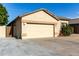 House exterior showcasing a two-car garage and side yard access at 5810 W Puget Ave, Glendale, AZ 85302