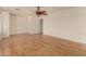 Bright living room with hardwood floors and ceiling fan at 5810 W Puget Ave, Glendale, AZ 85302