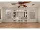 Living room featuring built-in shelving and hardwood floors at 5810 W Puget Ave, Glendale, AZ 85302