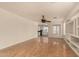 Spacious living room with wood floors and built-in shelving at 5810 W Puget Ave, Glendale, AZ 85302