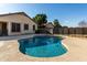 Inviting kidney shaped pool with surrounding patio at 5810 W Puget Ave, Glendale, AZ 85302