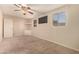 Spacious bedroom with carpeted floors and built-in corner shelving at 6046 W Carol Ann Way, Glendale, AZ 85306