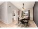 Charming dining room featuring a round wooden table and four chairs at 6046 W Carol Ann Way, Glendale, AZ 85306