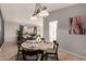 Bright dining area with a round table, perfect for Gathering meals at 6046 W Carol Ann Way, Glendale, AZ 85306