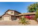 Attractive two-story house with a landscaped yard and two-car garage at 6046 W Carol Ann Way, Glendale, AZ 85306