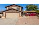 Two-story house with attached garage and landscaping at 6046 W Carol Ann Way, Glendale, AZ 85306