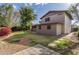 Back exterior view of house with landscaping and patio at 6046 W Carol Ann Way, Glendale, AZ 85306