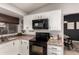 Well-equipped kitchen boasting white cabinets and a stylish backsplash at 6046 W Carol Ann Way, Glendale, AZ 85306