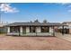 Charming single story home with a green door and gravel driveway at 615 W Enid Ave, Mesa, AZ 85210