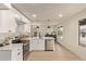 Modern kitchen with white cabinets, stainless steel appliances, and quartz countertops at 615 W Enid Ave, Mesa, AZ 85210