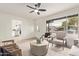 Living room with a view into the kitchen and access to the outdoors at 615 W Enid Ave, Mesa, AZ 85210