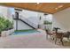 Private backyard oasis with a refreshing pool, patio seating, and modern staircase at 6916 E 2Nd St, Scottsdale, AZ 85251