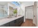 Elegant bathroom with marble vanity, double sinks, and a walk-in shower at 6916 E 2Nd St, Scottsdale, AZ 85251