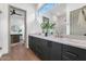 Modern bathroom with marble countertops and dark cabinetry at 6916 E 2Nd St, Scottsdale, AZ 85251