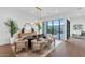 Bright dining area with modern light fixture and hardwood floors at 6916 E 2Nd St, Scottsdale, AZ 85251