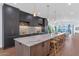 Modern kitchen with large island and marble countertops at 6916 E 2Nd St, Scottsdale, AZ 85251