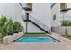 Private backyard pool with modern staircase and landscaping at 6916 E 2Nd St, Scottsdale, AZ 85251