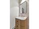 Modern powder room with wood vanity and marble countertop at 6916 E 2Nd St, Scottsdale, AZ 85251