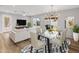 Elegant dining area with glass table and access to backyard at 7443 E Taylor St, Scottsdale, AZ 85257