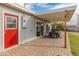 Covered patio with brick pavers and dining set at 7443 E Taylor St, Scottsdale, AZ 85257