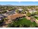 Aerial view of single-story home, spacious backyard, and mountain views at 7550 E Ironwood Ct, Scottsdale, AZ 85258