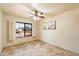 Bedroom with tile flooring and window with shutters at 7550 E Ironwood Ct, Scottsdale, AZ 85258