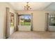 Dining room with large windows and backyard view at 7550 E Ironwood Ct, Scottsdale, AZ 85258