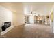 Gathering room with fireplace and view of kitchen at 7550 E Ironwood Ct, Scottsdale, AZ 85258