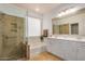 Bathroom with double vanity, soaking tub, and glass shower at 7606 E Globemallow Ln, Gold Canyon, AZ 85118