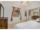 Bedroom with double bed, ceiling fan, and mirrored closet doors at 7606 E Globemallow Ln, Gold Canyon, AZ 85118