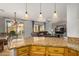 Kitchen with granite countertops, wood cabinets, and stainless steel appliances at 7606 E Globemallow Ln, Gold Canyon, AZ 85118