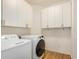 Laundry room with washer, dryer, and ample cabinets at 7606 E Globemallow Ln, Gold Canyon, AZ 85118