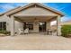 Covered patio with brick pavers and seating area at 7606 E Globemallow Ln, Gold Canyon, AZ 85118