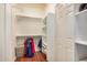 Bright walk-in closet with shelves and hanging rods at 7606 E Globemallow Ln, Gold Canyon, AZ 85118