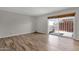 Bedroom with wood-look floors and sliding glass doors to a patio at 7751 E Glenrosa Ave # C5, Scottsdale, AZ 85251