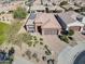 Aerial view of house, landscaping, and neighborhood surroundings at 86 E Iloca Ln, Queen Creek, AZ 85140