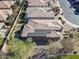 Aerial view highlighting home's roofline, solar panels, and backyard at 86 E Iloca Ln, Queen Creek, AZ 85140