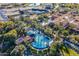 Aerial view of community pool, tennis courts, and clubhouse at 86 E Iloca Ln, Queen Creek, AZ 85140